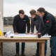 Civil engineers reviewing site plans outdoors
