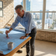 Architect stamping blueprints in Florida office