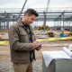 Forensic engineer inspects active construction site
