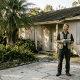 Engineer inspecting Florida home exterior after damage